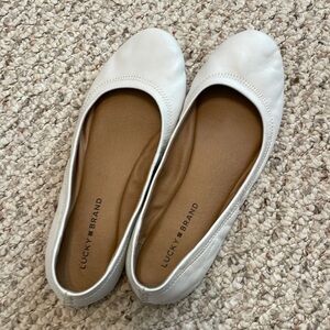 White ballet flats